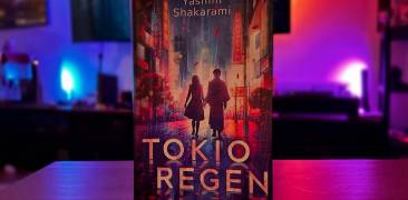 Buch "Tokioregen" vor farbigem Hintergrund mit Neonlichtern